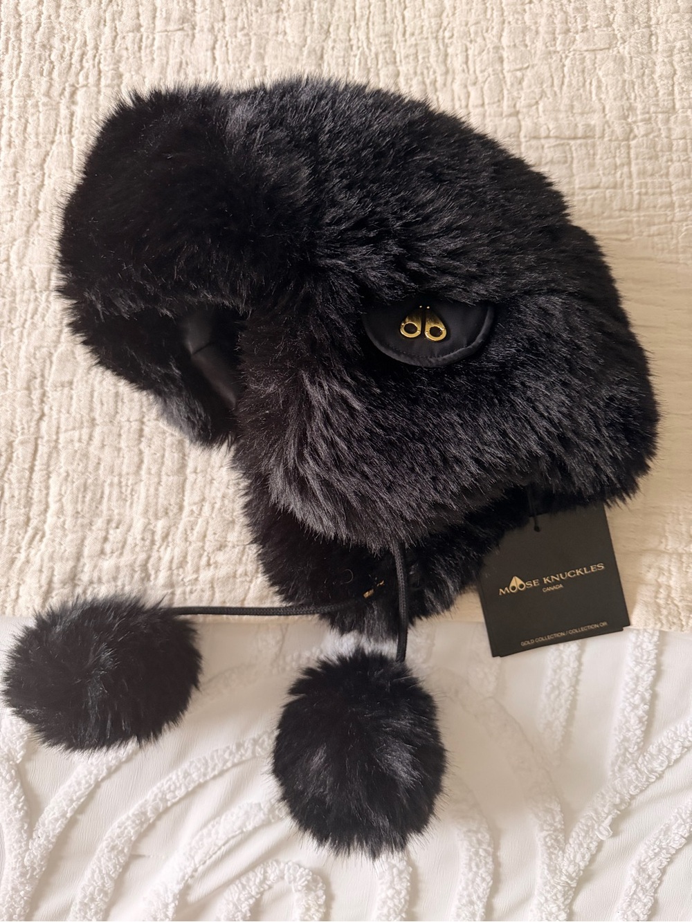 Moose Knuckles Black Faux Fur Trapper Hat with Gold Logo Tag